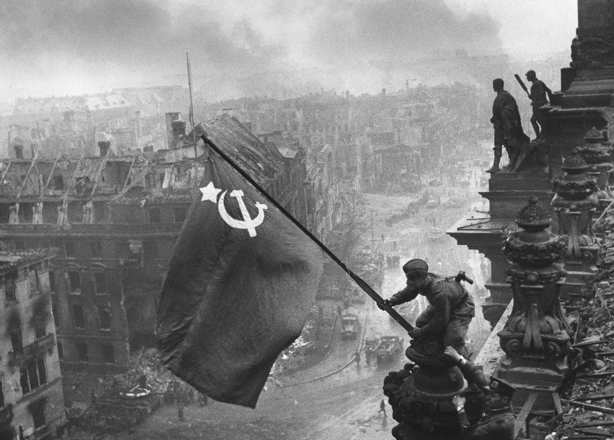 The iconic "Raising a flag over the Reichstag" photo by Yevgeny Khaldei. 
